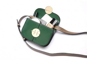 Crossbody clutch bag with circle buckle